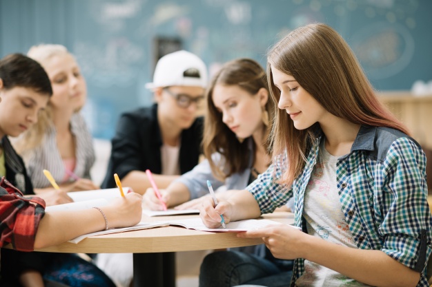 team-students-completing-task_23-2147666610